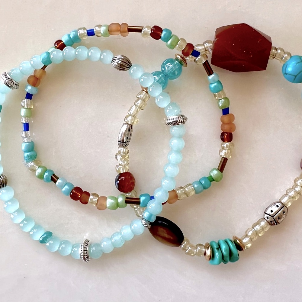 multi-colored stack of 4 beaded fashion stretch bracelets